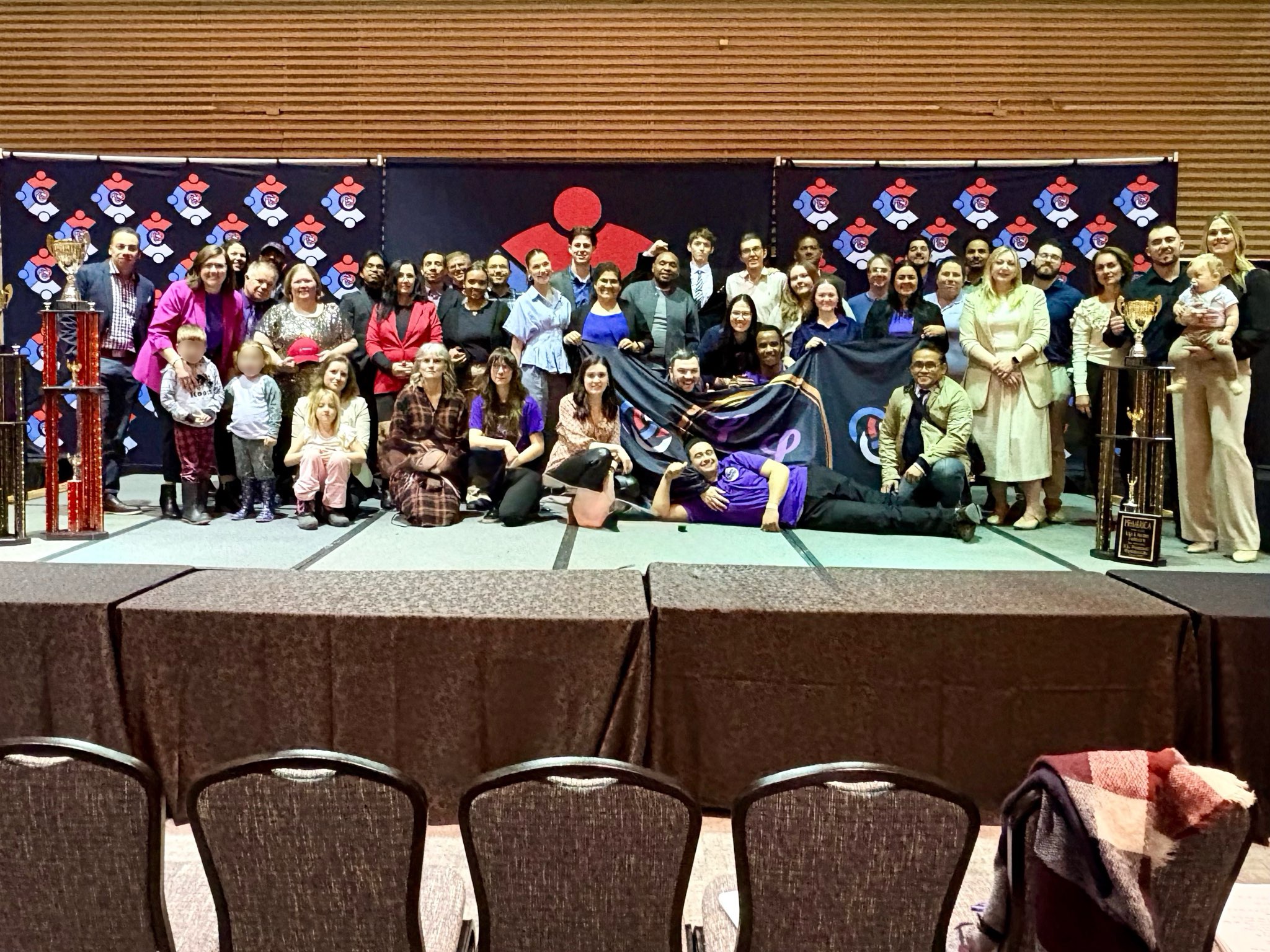 Consortium attendees gathered together at a team event.